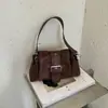 Bolsa Carteiro Retrô de Nicho Bolsa de Ombro para Mulheres 2026 Nova Moda Bolsa de Motociclista Bolsa de Mão de Alto Padrão Bolsa Transversal de Ombro