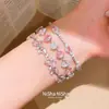 Pulsera con colgante ovalado de circón rosa fresco con un diseño único, personalidad de nicho, lujo ligero y sensación de alta gama