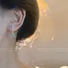 Brincos Azuis em Forma de C Estilo Hong Kong Retrô para Mulheres 2026 Novo Modelo Popular Brincos de Moda Estilosos com Toque de Luxo e Design Exagerado
