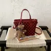 2026 Otoño Temprano Nuevo Artículo Bolsita Cuadrada Pequeña con Personalidad Elegante Bolso de Hombro de Gran Capacidad para Mujer Bolso de Mano de Color Sólido de Alto Valor