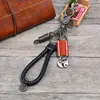Llavero de cuero tejido vintage directo de fábrica tienda en línea creativa regalo pequeño simple coche llavero de piel de vaca