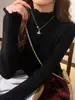 Blusa Base de Malha com Gola Meia-Alta Lateral para Mulheres Outono Inverno Roupa Íntima Roupa Externa Suéter Design Gentil Senso de Estilo Top de Nicho