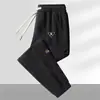 Pantalones de chándal de pana para hombre para otoño, pantalones casuales de retazos, corte holgado, pantalones jogger versátiles y modernos, pantalones largos para hombre