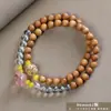 Pulseira de contas de oração budista de madeira crua natural, vendida a quente, sândalo dourado, sândalo Barbie, pulseira colecionável para homens e mulheres, fornecimento para live-stream