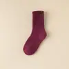 Calcetines de color sólido de comercio electrónico transfronterizo, venta al por mayor de invierno, calcetines altos de tubo gruesos y cálidos para mujer, calcetines de comercio exterior