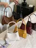 Bolso de axila tejido a mano de estilo coreano de nicho transfronterizo para mujer, bolso de mano casual de moda, bolso de cubo de hombro de gran capacidad