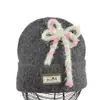 Gorro de punto estilo coreano de mezcla de lana inspirado en la dopamina con un lazo, un gorro de invierno cálido y protector para las orejas para mujer, adecuado para estudiantes