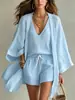 Conjunto de três peças europeu e americano transfronteiriço para primavera, verão e outono, com caimento solto, comprimento médio, apresentando cardigã de manga três quartos, colete sem mangas e shorts para uso casual.