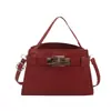 Bolsa Kelly de cor lisa nova transfronteiriça, fivela, bolsa quadrada pequena, bolsa de mão moderna e elegante, senso de temperamento, bolsa de ombro única para mulheres