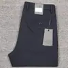 Novos calças casuais retas masculinas de luxo importadas para Primavera e Verão com bolso oblíquo, calças pretas simples estilo Europeu e Americano para homens de negócios