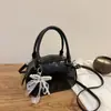 Nuevo Diseño Exclusivo 2025 Moda Coreana Textura Bolso de Mano Bolso Bowling para Mujer Versátil Bolso de Hombro Cruzado