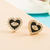 Pendientes de aro con forma de corazón chapados en cobre y microincrustaciones de oro auténtico con circonitas y ojos de diablo, venta al por mayor, entre Europa y Estados Unidos.