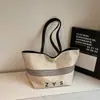 Bolsa de Lona de Grande Capacidade para Mulheres 2025 Nova Casual Coreana de Nicho Versátil Bolsa de Ombro para Trabalho e Bolsa para Roupas de Trabalho