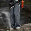 Pantalones casuales nuevos para hombre para trabajo al aire libre, resistentes al agua, con diseño dividido, pantalones largos y cierre ajustable de cuatro botones.