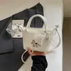 Bolso Pequeño Versátil de Alta Gama Transfronterizo Nuevo Primavera 2026 Bolso de Mujer Bolso de Hombro Único Bolso Cruzado de Cubo Popular