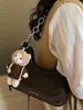 Bolso de Alto Valor Estilo Coreano Otoño 2026 Nuevo Lanzamiento Bolso de Cadena de Nicho Bolso Baguette para Debajo del Brazo Bolso de Hombro Sencillo y Elegante Bolso Cruzado