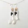 21 otoño e invierno Nuevo estilo coreano calcetines de felpa con letra P de moda hasta la pantorrilla calcetines de pareja Deportivos y de Ocio Universitarios ins Dongdaemun