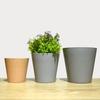 Maceta redonda para plantas de jardinería de interior y exterior, directa de fábrica, maceta de plástico simple y carnosa, en stock, al por mayor