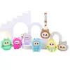 Bolsa de monedas de silicona de dibujos animados al por mayor, llavero colgante, funda para auriculares, mini bolsa de almacenamiento, muñeco llavero bolsa colgante