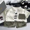 Ropa para Niños de Comercio Exterior 2026 Nuevo Estilo Infantil Bloques de Color Bolsillo Tie-Dye Camisa Inglesa Chaqueta Verano Manga Corta Conjunto de Tres Piezas