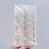 Novo alfinete de cintura com pérolas artificiais, artefato de cintura, broche de fivela anti-luz para suéter cardigã feminino, fornecimento de loja de 2 reais