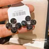 Pendientes de Flor Redonda con Circonitas y Tachuelas Negras, Estilo Europeo y Americano Fresco, Pendientes de Alta Gama