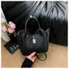 Bolsas de nicho de alta costura 2026 nuevos bolsos de mano modernos y elegantes bolsos de cubo cruzados populares de verano para mujer