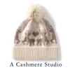 Nova coleção outono e inverno: gorro de tricô simples e versátil com pompom, feito de cashmere, apresentando um design color-block com um pequeno motivo de veado, oferecendo um visual moderno, casual e quente