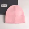 2022 nuevo gorro de punto con volantes de color liso para mujer, gorro de invierno de otoño e invierno, gorro de lana cálido de comercio exterior, combina con todo