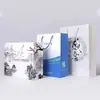 Bolsa de mano impresión color bolsa de papel tienda de ropa publicidad impresión cartón blanco embalaje de regalo fabricantes de bolsas de compras