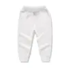 Pantalones de chándal lisos para niños 2026 Primavera y Otoño Nuevos Casuales Deportivos Versátiles para Niños y Niñas Pantalones Largos de Algodón Puro Venta al por Mayor de Fábrica