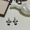 Cadena de Suéter Cruzada Blanca y Negra Dulce y Fresca Nicho Elegante Único Lujo de Gama Alta Accesible Moda Versátil Collar Pendientes