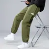 Calças masculinas casuais calças de tornozelo amarradas primavera e outono coreanas moda esportiva calças de cor sólida micro elásticas estilo celebridade da internet macacões
