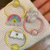 Diadema Trenzada Arcoíris para Niños Goma para el Cabello Muñeco de Dibujos Animados Lindo Goma Elástica Accesorios para el Cabello DIY Estuche de Cuero para Mujer Venta al por Mayor