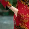 Cheongsam para madre de mediana edad otoño e invierno manga larga forro polar engrosado vestido de boda talla grande retro mejorado elegante vestido largo
