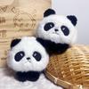 Venta al por mayor 4 pulgadas boutique peluche colgante muñeca máquina muñeca lindo dibujos animados peluche pequeña bolsa de joyería adornos
