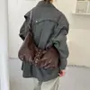Bolsas femininas de nicho de alta qualidade Outono/Inverno 2026 Nova Bolsa Transversal de Ombro Único Versátil para Trabalho na Axila Bolsa Dumpling