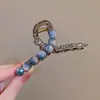 Pin para el pelo de bienestar de fin de año 2026 fábrica de accesorios para el pelo gran liquidación caza de gangas de accesorios para el pelo artículos en liquidación pinza de garra pinza de tiburón accesorios para el pelo gomas para el pelo