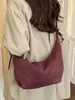 Yuezhi 2026 principios de otoño nuevo modelo de alta gama diseño de bolsa grande con patrón tejido bolsa de albóndiga para la ciudad bolsa de hombro retro bajo el brazo