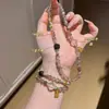 Pulseira de Cristal Natural com Contas Super Sete Ouro Negro, Novo Estilo Chinês Luxo Leve Pulseira Multicamadas Feita à Mão