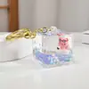 Pato de banho criativo com areia movediça líquida chaveiro feminino pato fofo garrafa flutuante boneca pingente de mochila presente atacado