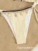 Comercio Electrónico Transfronterizo se Especializa en Suministrar Lotes Directos de Fábrica en Stock de Modelos Populares Europeos y Americanos de Bikini de Dos Piezas con Escote Halter y Cordones