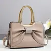 Bolso de Mujer con Lazo Nuevo de Charol Brillante Bolso de Mano de Moda Versátil Transfronterizo Popular Bolso de Mujer al por Mayor