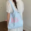 Bolsa Tote com Cordão Estilo Coreano Cor Sólida Estampa de Letras Transfronteiriça Bolsa Pequena de Lona Fresca Feminina Grande Capacidade para o Dia a Dia Bolsa de Ombro Único