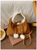 Bolso de mano de piel de cordero de nicho estilo coreano, nuevo bolso de terciopelo retro tipo nube para mujer con lazo, bolso de hombro, bolso cruzado, moderno
