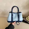 Bolsa de Mão de Luxo Exquisita de Nicho para Mulheres 2026 Nova Tendência Coreana Versátil para o Dia a Dia Ombro Transversal Bolsa de Jardim
