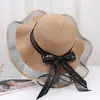 Nuevo Sombrero de Paja para Mujer Verano Viaje Sombrilla Sombrero Playa Mar Protector Solar Sombrero Estilo Coreano Ala Ancha Moño Anti-UV