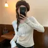 Tejido de hilo de núcleo retorcido Textura de cinta tejido de punto jacquard suéter para mujer cuello redondo corte ajustado versátil camiseta de manga larga