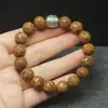 Ventas directas del fabricante: Pulsera de una sola hebra tallada en sándalo dorado para atraer la fortuna, Abalorios budistas de estilo étnico, Artículo cultural unisex, Venta al por mayor y entrega