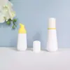 En stock botella cónica blanca de espuma de 60 ml, botella espumadora de PET para mousse de 100 ml, dispensador portátil de espuma facial